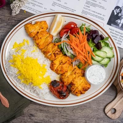Close-up of grilled kabobs and saffron rice
